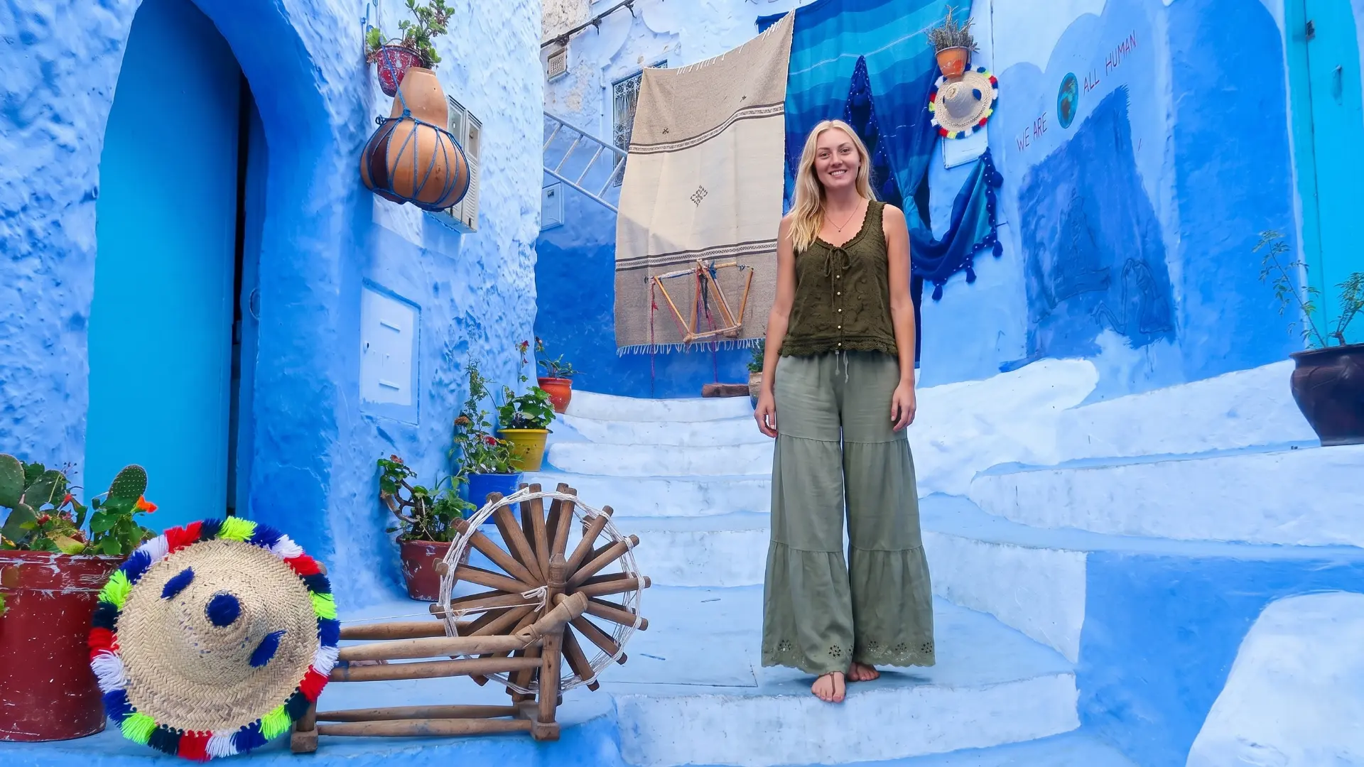 Blue painted alleyway with arched doorway in Chefchaouen medina