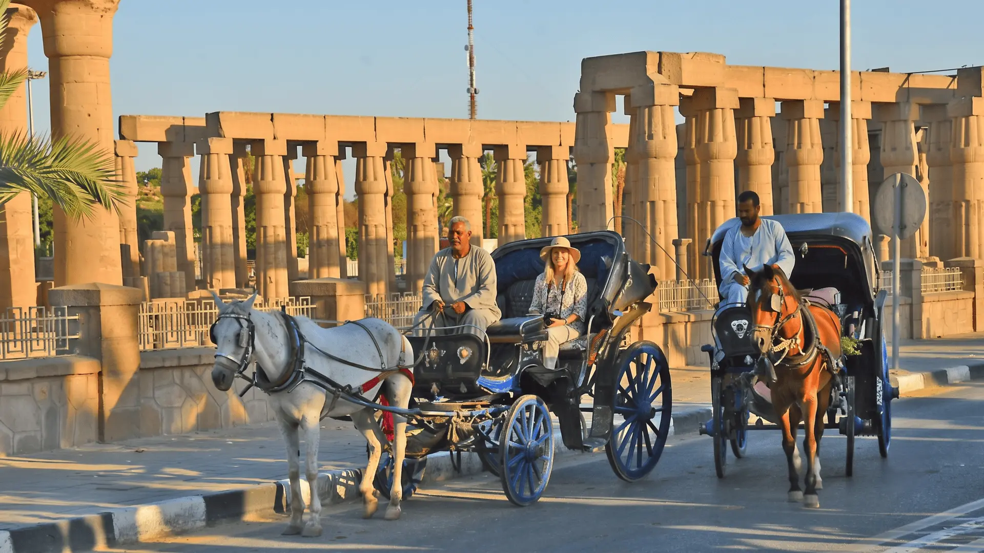 Enjoying a traditional calèche (horse-drawn carriage) ride through the streets of Luxor, Egypt