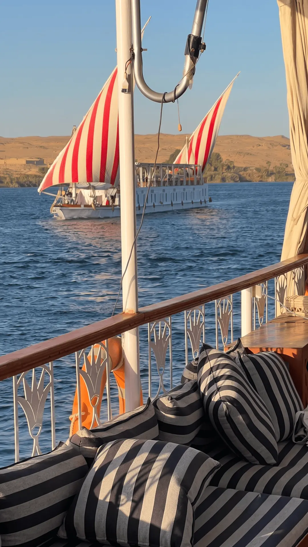 Elegant dahabiya sailing on the Nile River during a classic cruise in Egypt