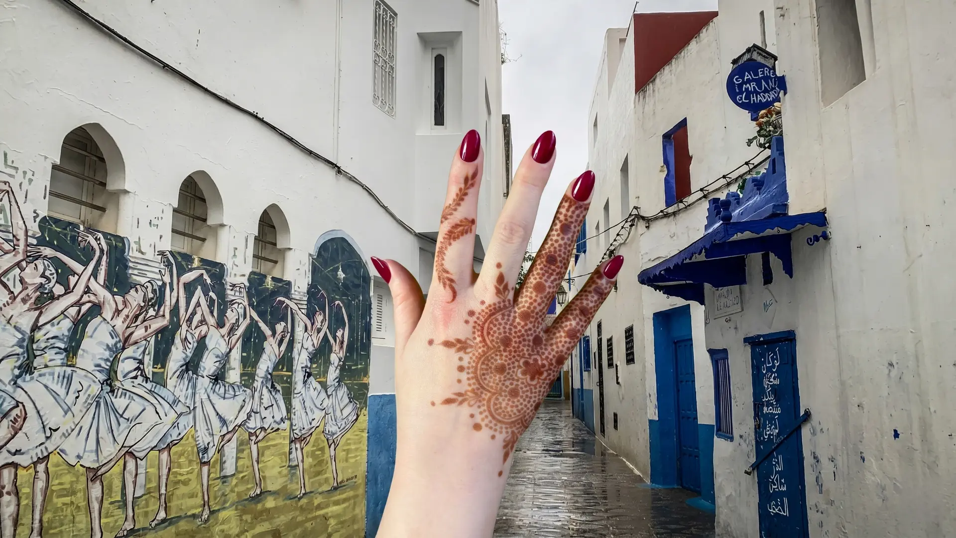Traditional Moroccan henna design being applied in Asilah