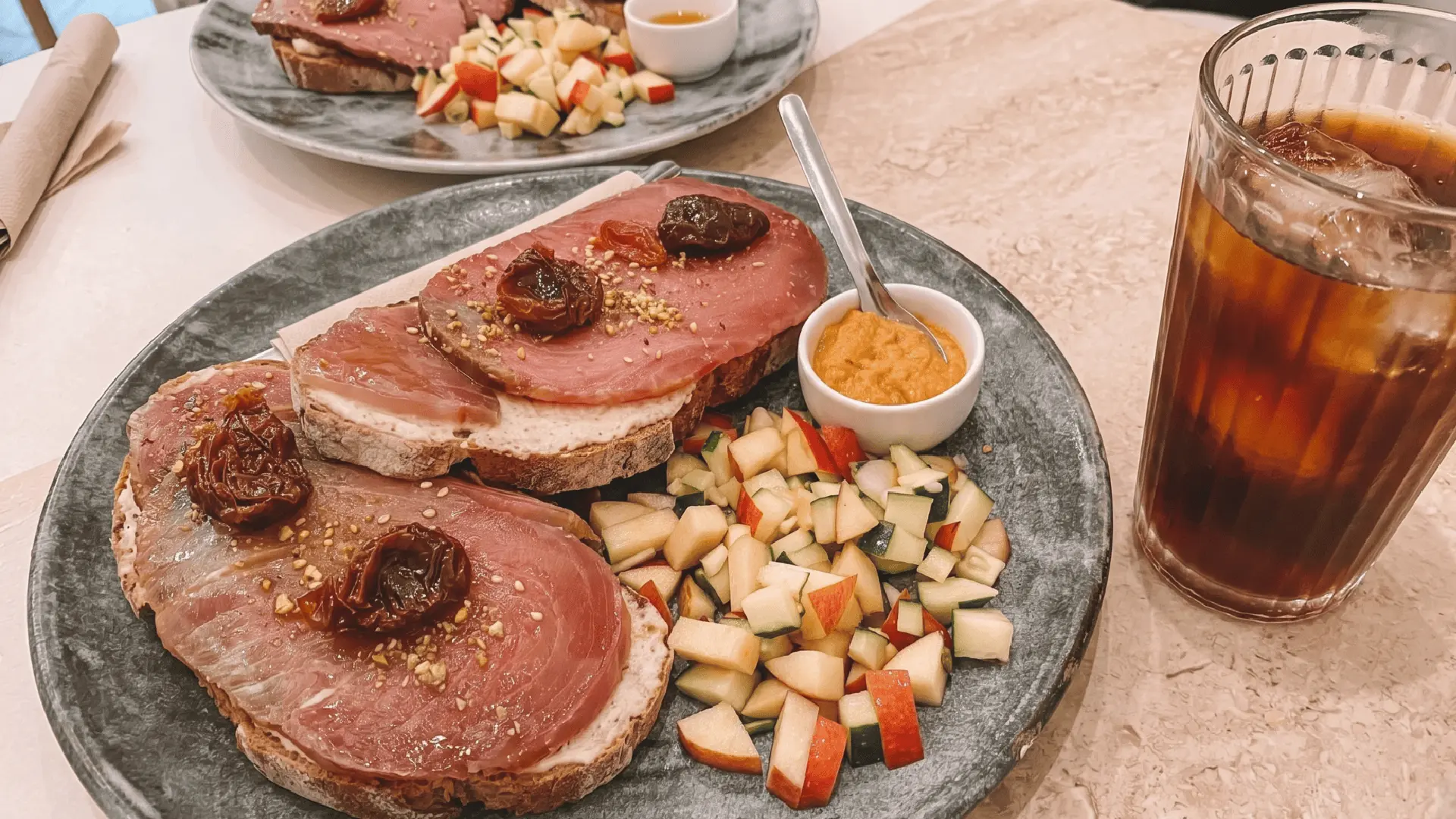 Tasty steak toast served at a traditional local restaurant in downtown Seville, Andalusia