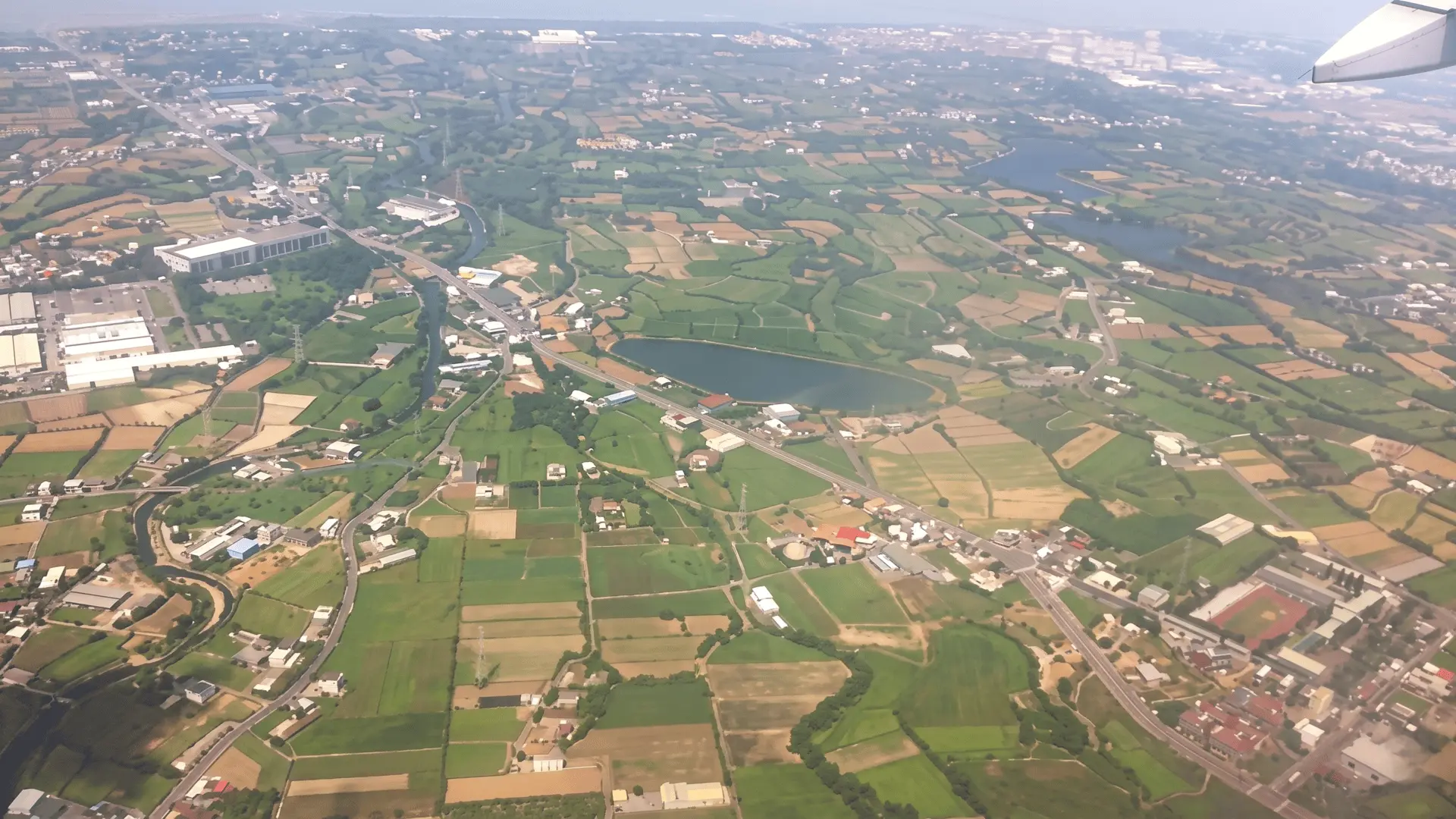 Beautiful aerial view of Taipei cityscape with Taipei 101 visible during airplane landing or takeoff