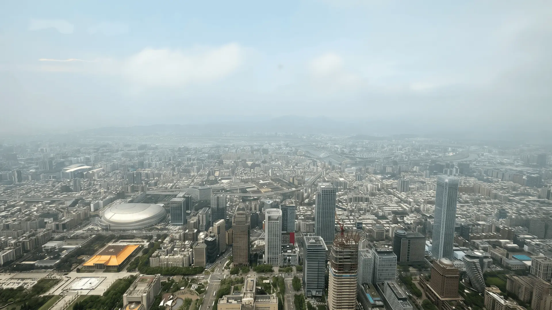Stunning daytime or nighttime skyline of Taipei city viewed from Taipei 101