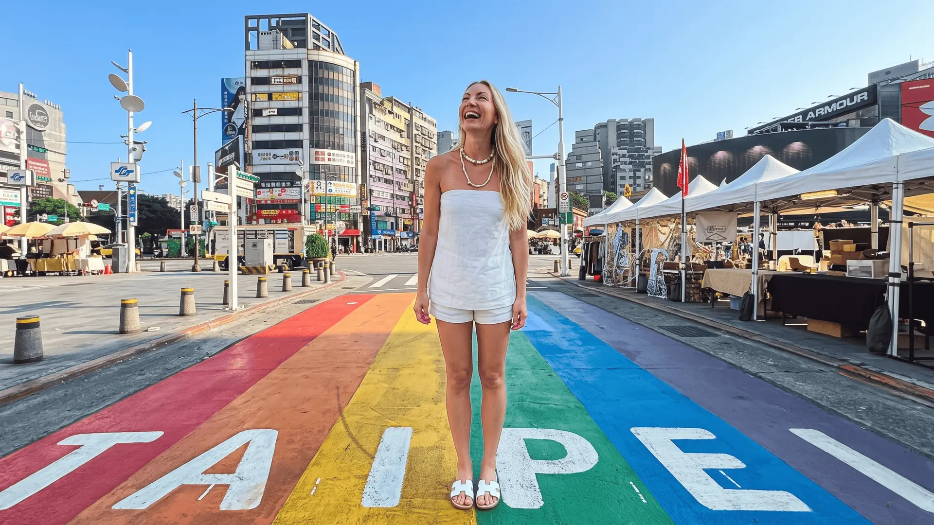 Vibrant Rainbow Street in Ximending Taipei with colorful pride flags and street art